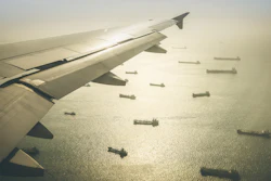 Aerial View Of Industrial Cargo Ships Fleet Moving To The Harbour Of Singapore In South East Asia Retro Contrasted Dramatic Filter 858962942 3623x2236