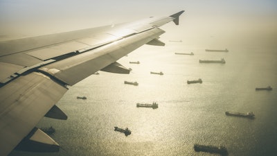 Aerial View Of Industrial Cargo Ships Fleet Moving To The Harbour Of Singapore In South East Asia Retro Contrasted Dramatic Filter 858962942 3623x2236