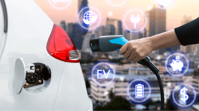 Air Pollution And Reduce Greenhouse Gas Emissions Concept Hand Holding And Charging Electric Car With Blur City View Background 676364004 5000x3333