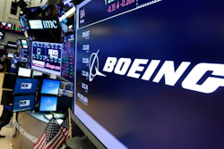 In this July 24, 2017 file photo, the Boeing logo appears above a trading post on the floor of the New York Stock Exchange. Boeing Co. on Wednesday, Jan. 31, 2018, reported fourth-quarter profit of $3.13 billion. The Chicago-based company said it had net income of $5.18 per share. Earnings, adjusted for pretax gains, came to $4.80 per share.