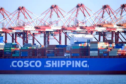 In this Jan. 12, 2018 photo, trucks move containers are loaded onto a ship at a port in Qingdao in eastern China's Shandong province. China's export growth accelerated in January in a sign of resilient global demand while imports surged as factories stocked up before closing for the two-week Lunar New Year holiday.
