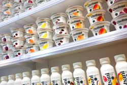 In this Nov. 20, 2017, file photo, Chobani yogurt cups are displayed in New York. As Chobani turns 10, CEO and founder Hamdi Ulukaya talked to The Associated Press about yogurt’s place in online grocery delivery, products made from almonds and peas that are moving into the yogurt case and why the company is giving away free yogurts.