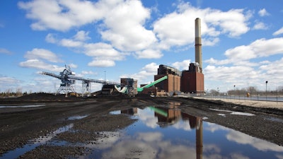n this April 12, 2016, file photo, the B.C. Cobb Plant, which closed April 15, 2016 is shown in Muskegon, Mich. A major Michigan utility says it will reduce carbon emissions by 80 percent and no longer use coal to generate electricity by 2040. Consumers Energy is the second state utility to announce it's phasing out coal as it switches more to cleaner and renewable sources.