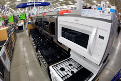 This Jan. 22, 2018, file photo shows a Whirlpool microwave and oven on display in the appliance section of a Lowe's in Wexford, Pa. On Tuesday, Feb. 27, 2017, the Commerce Department releases its report on durable goods for January.