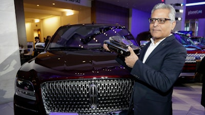 Kumar Galhotra stands next to the 2018 Lincoln Navigator after the vehicle won truck of the year during the North American International Auto Show. Galhotra has been named the replacement for Raj Nair, the president for North America, who was ousted this week over allegations of inappropriate behavior.