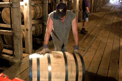 In this June 29, 2000, file photo, Tracy Matlock, left, and David Culpepper, right, move barrels of Jack Daniel's whiskey from one of the warehouses at the famous distillery in Lynchburg, Tenn. Jack Daniel's is turning to state lawmakers to ensure that distillers aren't subject to property tax on whiskey barrels in Tennessee, which the company says it hasn't had to pay since at least the end of Prohibition eight decades ago.