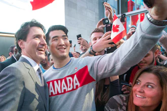 Prime Minister Justin Trudeau poses for photos with employees as he leaves the offices of Salesforce on Thursday, Feb. 8, 2018 in San Francisco.