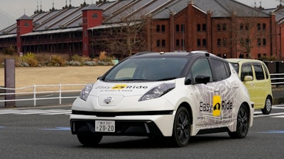 In this Wednesday, Feb. 21, 2018, photo, Nissan Motor Co.'s Easy Ride robo-vehicle goes on a course during a test ride in Yokohama, near Tokyo. Starting next month, Nissan is testing on regular roads what it calls “a robo-vehicle mobility service.” Called Easy Ride, it uses a cell-phone app to book semi-autonomous driven rides.