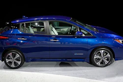 In this Tuesday, Sept. 5, 2017, file photo, the 2018 Nissan Leaf is on display during an unveiling event in Las Vegas. Electric car prices are falling, but they still cost more than equivalent gas models because of their expensive batteries.
