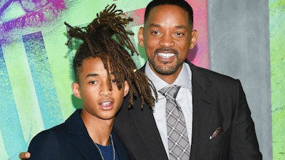In this Aug. 1, 2016 file photo, Jaden Smith, left, and his father Will Smith attend the world premiere of 'Suicide Squad' in New York. The Smiths have founded an eco-friendly bottled-water company called Just, which is unveiling a new line of flavored waters next month.