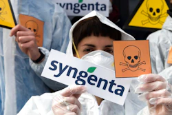 In this April 6, 2017, file photo, activists of the Basel political action committee 'March against Monsanto and Syngenta' protest in front of the Syngenta headquarters against the acquisition of Syngenta by the Chinese company ChemChina, in Basel, Switzerland. After a February 2018 announcement, critics are blasting the U.S. Environmental Protection Agency for dramatically lowering a fine on agribusiness company Syngenta for violations of pesticide regulations.