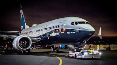 The first 737 MAX 7 is pulled into position for its debut at Boeing's Renton, Wash. factory.