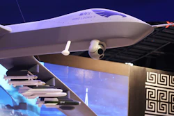 A model of a Wing Loong II weaponized drone hangs above the stand for the China National Aero-Technology Import & Export Corp. at a military drone conference in Abu Dhabi, United Arab Emirates, Sunday, Feb. 25, 2018. The United Arab Emirates on Sunday opened a stand-alone trade show featuring military drones called the Unmanned Systems Exhibition & Conference, showing the power the weapons have across the Middle East.