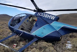 In this photo taken Monday, Feb. 12, 2018, and provided by the Wasatch County Sheriff's Office is a research helicopter that was brought down by a leaping elk in the mountains of eastern Utah. Wasatch County authorities say the elk jumped into the chopper's tail rotor as the craft flew low, trying to capture the animal with a net. The two people on board weren't seriously hurt, but wildlife officials say the elk died of its injuries. The state-contracted Australian crew had been trying to capture and sedate the elk so they could collar it and research its movements about 90 miles east of Salt Lake City.