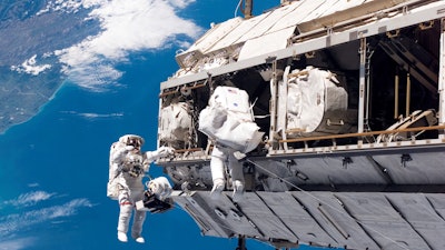 In this Dec. 12, 2006, file photo, made available by NASA, astronaut Robert L. Curbeam Jr., left, and European Space Agency astronaut Christer Fuglesang, participate in a space walk during construction of the International Space Station. Under President Donald Trump’s 2019 proposed budget released, Monday, Feb. 12, 2018, U.S. government funding for the space station would cease by 2025. The government would set aside $150 million to encourage commercial development.