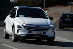 In this Monday, Feb. 12, 2018, photo, Hyundai's autonomous fuel cell electric vehicle Nexo is driven along a road near the Pyeongchang Olympic Stadium in Pyeongchang, South Korea. At Pyeongchang Winter Olympic Games, there are two futures of self-driving vehicles in two different Olympic venues by two different companies. In a reminder of a proxy war between automakers and tech companies, Hyundai and KT have negotiated over the exclusive right to use the buzzword.