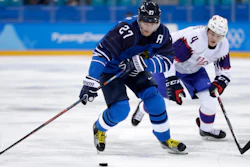 Petri Kontiola (27), of Finland, drives the puck against Johannes Johannesen (4), of Norway, during the first period of the preliminary round of the men's hockey game at the 2018 Winter Olympics in Gangneung, South Korea, Friday, Feb. 16, 2018.