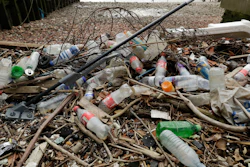 Plastic bottles and other plastics including a mop, lie washed up on the foreshore at the site of the ancient and no-longer used Queenhithe dock, a designated scheduled monument which dates back to at least the time of King Alfred the Great who lived from 849 to 899 AD, on the north bank of the River Thames in London, Monday, Feb. 5, 2018. Amid growing evidence of dire amounts of waste in the world’s oceans, conservation is becoming a selling point for firms trying to jump on the bandwagon of concern about the flood of plastic choking sea life.