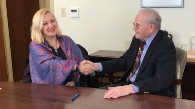 Jody Richards, President, Process Technology and Norm Osero, Chairman of Dynatronix at the signing.