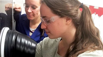 Ellen Matson, left, University of Rochester assistant professor of chemistry, and University of Rochester PhD student Lauren VanGelder at work in Matson's lab. VanGelder is lead author on a paper describing modifications to a redox flow battery that make it nearly twice as effective for electrochemical energy storage.