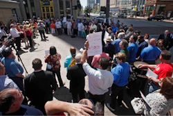 This Wednesday, May 1, 2013 file photo shows the AFL-CIO protesting proposed Right to Work Legislation on the South East corner of the Statehouse in Columbus, Ohio. A handful of states in the Midwest now surrounded by neighbors with so-called right-to-work laws are facing new efforts aimed at changing their labor laws. In Ohio, a pair of Republican lawmakers wants to put the issue before voters in two years. Missouri's new right-to-work law will go to a statewide referendum in November.