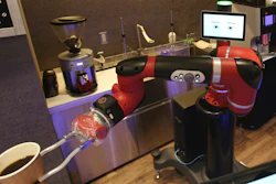 Robot barista named 'Sawyer' makes a coffee at Henn-na Cafe, Japanese meaning 'Strange Cafe'in Tokyo, Friday, Feb. 2, 2018. The cafe's robot barista brews and serves coffee as the rapidly aging country seeks to adapt to shrinking workforce. The arm robot 'Sawyer' debuted this week in Tokyo‘s downtown business and shopping district of Shibuya.