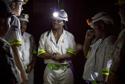 In this Feb. 1, 2018 photo, rescue workers prepare to rescue more than 900 miners from the Sibanye-Stillwater's Beatrix mine near Welkom, South Africa. The miners were brought to the surface Friday Feb. 2 2018 after a power failure, caused by a severe storm Wednesday had prevented lifts from bringing the night shift to the surface.