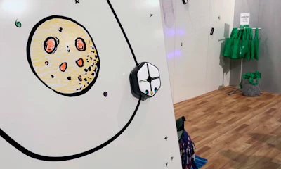 n this Jan. 9, 2018, image made from a video, the Root robot traces a line down a wall using its magnetic treads at the CES gadget show in Las Vegas. Root draws, moves, sees and reacts to touch and various other commands. Kids can use Root to start drawing lines and progress to creating snowflake-like mathematical patterns called fractals.