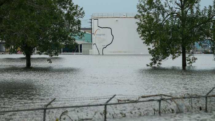 In this Aug. 30, 2017 photo, the Arkema chemical plant is flooded from Hurricane Harvey in Crosby, Texas, northeast of Houston. Nearby residents complain of a 'bitter taste' about the sparse information authorities provided when chemicals at the plant caught fire. They say the company failed to provide sufficient warning beforehand while environmental officials misled them with assurances that the air and water were safe. Critics say testing by authorities and contractors was inadequate to determine whether public health was threatened.