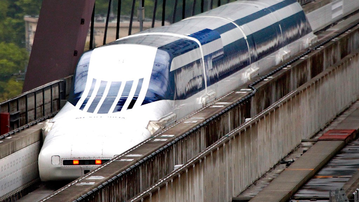 In this Tuesday, May 11, 2010, file photo, Japan's Magnetic Levitation, or linear motor car MLX01-901A runs on a rest course of Yamanashi Experiment Center in Tsuru, Japan. Prosecutors have formally charged four of Japan’s biggest construction companies in alleged collusion on bids for a multibillion dollar high-speed maglev train line connecting Tokyo and central Japan.