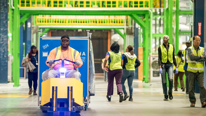 In this Friday, March 16, 2018 photo, workers navigate the factory floor at the Samsung washing machine facility, in Newberry, S.C. The appliance manufacturer on Monday, March 19 announced the expansion of its production footprint in South Carolina, making progress on a plan to create nearly 1,000 by 2020.