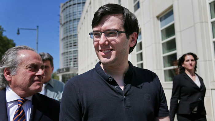 In this Aug. 4, 2017 file photo, Martin Shkreli, center, leaves federal court in New York. A judge has ruled that 'Pharma Bro' Martin Shkreli was responsible for nearly $10.5 million in losses in his securities fraud case. The amount set on Monday by Judge Kiyo Matsumoto could result in a harsher punishment for Shkreli at his March 9 sentencing.