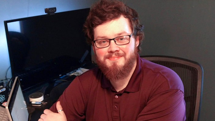 This Feb. 23, 2018 photo provided by the American Civil Liberties Union of Iowa shows Josh Harms in Sibley, Iowa. Harms, who said his hometown smelled like 'rancid dog food' because of an animal food processing plant sued the city Thursday, March 8, 2018 after he says they threatened to silence him. Harms with the help of the American Civil Liberties Union of Iowa filed suit in U.S. District Court asking a judge to block Sibley officials from making legal threats or taking action to force him to remove criticism from his website.