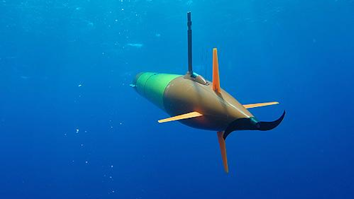 A long-range autonomous underwater vehicle carrying an environmental sample processor cruises beneath the surface during field trials in Hawaii.