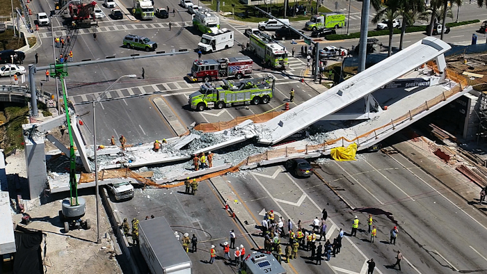 This photo provided by DroneBase shows the collapsed pedestrian bridge at Florida International University in the Miami area on Thursday, March 15, 2018.