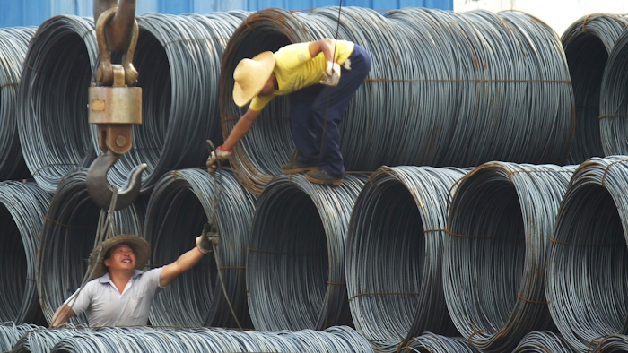 In this Aug. 1, 2016 photo, laborers work in the steel market in Yichang in central China's Hubei province. China has expressed “grave concern” about a U.S. trade policy report that pledges to pressure Beijing but had no immediate response to President Donald Trump’s plan to hike tariffs on steel and aluminum. The Commerce Ministry said Friday, March 2, 2018, that Beijing has satisfied its trade obligations and appealed to Washington to settle disputes through negotiation.