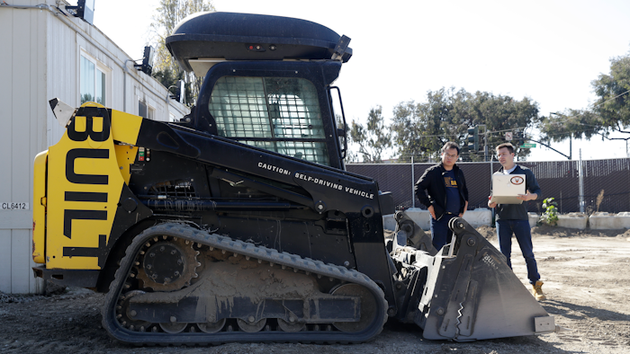 Bichen Wu, center, and Ed Walker use a laptop to determine what a autonomous bulldozer is seeing at Built Robotics Wednesday, Feb. 21, 2018, in San Francisco. Backed by Silicon Valley money, tech startups are developing self-driving bulldozers, drones to inspect work sites and robot bricklayers that can lay bricks faster than human and work without lunch breaks.