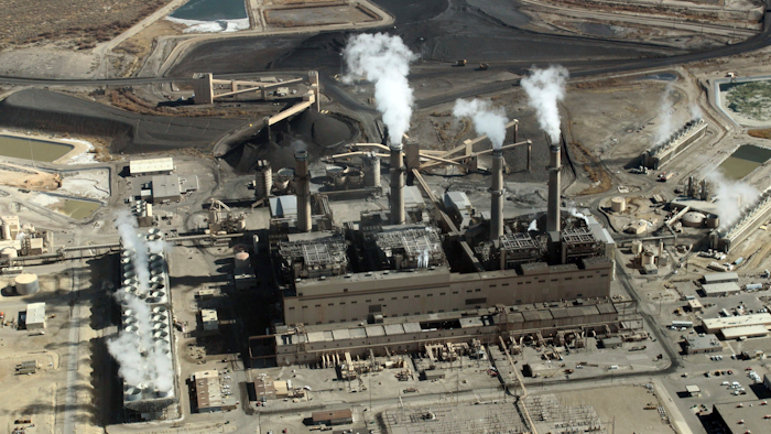 This file photo taken Nov. 9, 2009 image shows the coal-fired San Juan Generating Station near Farmington, N.M. One of the units at the San Juan Generating Station that serves customers in the southwestern United States has been taken offline as officials investigate a structural failure in one of its coal silos. Public Service Co. of New Mexico confirmed Tuesday, March 20, 2018, that the failure over the weekend at the generating station resulted in a fire and some damage that was limited to an area around the silo.