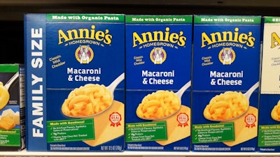 Boxes of Annie's Macaroni & Cheese are shown on the shelf at a supermarket in Edina, Minn., Sunday, March 4, 2018. Annie's is an organic and natural unit of food industry giant General Mills, which announced a deal Tuesday to create a 34,000-acre organic farm in South Dakota to supply it with organic wheat that will become pasta for the popular product.