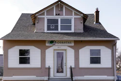 A Coastal Environment Group sign hangs Wednesday, March 21, 2018, on the front of a building registered as the offices of SWF Constructors in Omaha, Neb. Federal officials are saying little about how they chose SWF Constructors, a Nebraska startup to build an $11 million section of border wall in California, including whether they knew of the company’s connections to a construction firm flagged in a government audit for “many potential fraud indicators.”