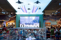 In this Aug. 1, 2017, file photo, visitors look at a scale model of a Chinese aircraft carrier during an exhibition to mark the 90th anniversary of the founding of the People's Liberation Army at the military museum in Beijing. China's defense budget will rise 8 percent to 1.1 trillion yuan ($173 billion) this year as the country is preparing to launch its second aircraft carrier, integrating stealth fighters into its air force and fielding an array of advanced missiles able to attack air and sea targets at vast distances, according to a report released Monday, March 5, 2018.