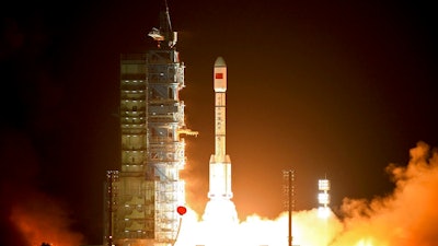 In this Sept. 29, 2011, file photo, a Long March-2FT1 carrier rocket loaded with China's Tiangong-1 space station blasts off from the launch pad at the Jiuquan Satellite Launch Center in northwest China's Gansu Province. China’s defunct and believed out-of-control Tiangong 1 space station is expected to re-enter Earth’s atmosphere sometime in the coming days, although the risk to people and property on the ground is considered low.