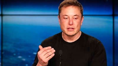 In this Feb. 6, 2018, file photo, Elon Musk, founder, CEO of SpaceX and CEO of Tesla Inc., speaks at a news conference after the Falcon 9 SpaceX heavy rocket launched successfully from the Kennedy Space Center in Cape Canaveral, Fla. Shareholders of electric car and solar panel maker Tesla Inc. are voting on a pay package for Musk that could net him more than $50 billion if he meets lofty milestones over the next decade that include raising the company's market value tenfold.