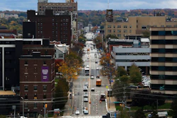In this Oct. 24, 2017, photo, vehicles travel along State Street, the main thoroughfare through town, as seen from the Bicentennial Tower in Erie, Pa. Since 2008, Erie has suffered a hidden and potentially more devastating exodus: The loss of well-paid white-collar jobs. City leaders in Erie say it needs to retain those white-collar workers, more than it needs a return to a blue-collar past where the factories covered the east side of town in brown soot and Lake Erie was reserved for shipping instead of swimming and tourism.