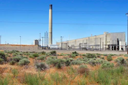 In this file photo taken June 13, 2017, the Plutonium Uranium Extraction Plant, right, stands adjacent to a dirt-covered rail tunnel, left, containing radioactive waste, amidst desert plants on the Hanford Nuclear Reservation near Richland, Wash. A new report says mistakes and mismanagement are to blame for the exposure of workers at the Hanford Nuclear Reservation in Washington state to radioactive particles in December.