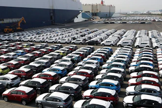 In this March 26, 2018, photo, Hyundai Motor's vehicles are seen at the company's export yard in Ulsan, South Korea. Unions at South Korea's two-largest automakers, Hyundai Motor and Kia Motors, say plans to revise a free trade deal with the United States involve concessions that will prevent local automakers from entering the fast-growing U.S. pick-up truck market.