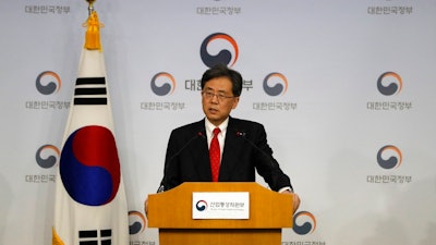 South Korean Trade Minister Kim Hyun-chong answers a reporter's question during a briefing at Foreign Ministry in Seoul, South Korea, Monday, March 26, 2018. South Korea has agreed to further open its auto market to the United States as the two countries reached an agreement in principle on amending their six-year-old free trade agreement.
