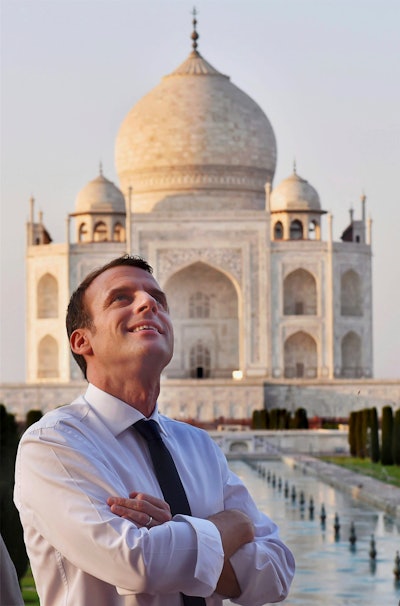 French President Emmanuel Macron admires the Taj Mahal in Agra, India.