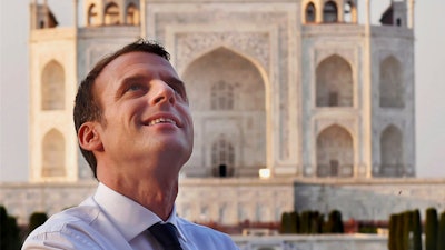 French President Emmanuel Macron admires the Taj Mahal in Agra, India.