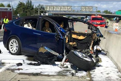 In this Friday March 23, 2018 photo provided by KTVU, emergency personnel work a the scene where a Tesla electric SUV crashed into a barrier on U.S. Highway 101 in Mountain View, Calif. The National Transportation Safety Board has sent two investigators to look into a fatal crash and fire Friday in California that involved a Tesla electric SUV. The agency says on Twitter that it's not clear whether the Tesla Model X was operating on its semi-autonomous control system called Autopilot at the time. Investigators will study the fire that broke out after the crash.